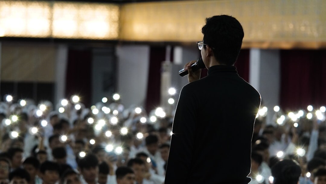 person giving speech on stage